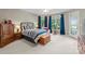 Cozy bedroom with a queen-size bed, soft carpeting, and a door to the outside balcony at 7412 Sahalee Dr, Denver, NC 28037