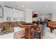 Game room with a game table, custom seating, and views of the living room at 7412 Sahalee Dr, Denver, NC 28037