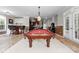 Basement game room with a pool table and seating and walkout access at 7412 Sahalee Dr, Denver, NC 28037