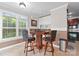 Game room featuring a game table with seating, built-in cabinetry, and natural light at 7412 Sahalee Dr, Denver, NC 28037