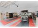 Tidy garage with a golf cart, storage shelves, and modern lighting at 7412 Sahalee Dr, Denver, NC 28037