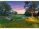 Enjoy picturesque golf course views from this property's lush green lawn, perfect for outdoor activities and relaxation at 7412 Sahalee Dr, Denver, NC 28037