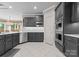 Stylish kitchen featuring dark cabinets, stainless appliances and recessed lighting at 7412 Sahalee Dr, Denver, NC 28037