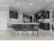 Modern kitchen with dark cabinets, white countertops, and stainless steel appliances at 7412 Sahalee Dr, Denver, NC 28037