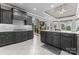 Spacious kitchen featuring dark cabinets, white countertops and a center island with views to the living room at 7412 Sahalee Dr, Denver, NC 28037