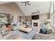 Bright and airy living room with a fireplace, vaulted ceilings, and large windows at 7412 Sahalee Dr, Denver, NC 28037