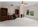 Well-lit office space with a built in desk and cabinet at 7412 Sahalee Dr, Denver, NC 28037