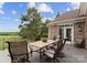 Spacious outdoor patio area with views of the golf course and landscaping at 7412 Sahalee Dr, Denver, NC 28037