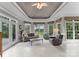 Cozy sunroom with neutral colors, a golf course view, and lots of natural light at 7412 Sahalee Dr, Denver, NC 28037