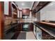 Wet bar features granite counters, backsplash, cabinets, sink and appliances at 7412 Sahalee Dr, Denver, NC 28037
