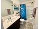 Bathroom featuring a vanity with sink, tile floors, and a shower-tub combination with curtain at 750 Fraternity Row, Kannapolis, NC 28081