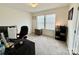 Bedroom featuring neutral walls and carpet, double windows, and a comfortable work from home setup at 750 Fraternity Row, Kannapolis, NC 28081