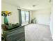 Bright bedroom featuring neutral carpet, a light fixture, and a double window dressed with curtains at 750 Fraternity Row, Kannapolis, NC 28081
