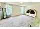 Spacious bedroom with large windows, neutral carpet, and ample natural light at 750 Fraternity Row, Kannapolis, NC 28081