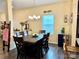 Formal dining room with an elegant chandelier and seating for eight at 750 Fraternity Row, Kannapolis, NC 28081