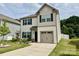 Charming two-story home featuring black shutters, and an attached one car garage at 750 Fraternity Row, Kannapolis, NC 28081