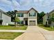 Charming two-story home with black shutters, a well-maintained lawn, and a beautiful front yard tree at 750 Fraternity Row, Kannapolis, NC 28081