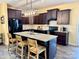 Well-lit kitchen features a large center island with seating and modern appliances at 750 Fraternity Row, Kannapolis, NC 28081