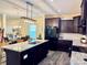 Spacious kitchen with black appliances, granite countertops, and an island with seating at 750 Fraternity Row, Kannapolis, NC 28081