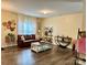 Inviting living room with hardwood floors, a comfortable leather sofa, and stylish decorative accents at 750 Fraternity Row, Kannapolis, NC 28081