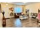 Inviting living room featuring hardwood floors, a comfortable leather sofa, and stylish wall decorations at 750 Fraternity Row, Kannapolis, NC 28081