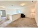 Upstairs loft area featuring neutral carpet, natural light, and a comfortable seating area at 750 Fraternity Row, Kannapolis, NC 28081