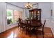 Dining room with hardwood floors, a large window, and a classic china cabinet at 8008 Alba Ct, Charlotte, NC 28269