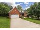 Charming brick home with a well-manicured lawn and a spacious driveway, ideal for suburban living at 8008 Alba Ct, Charlotte, NC 28269