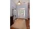Elegant foyer with hardwood floors, crown molding, and a decorative light fixture at 8008 Alba Ct, Charlotte, NC 28269