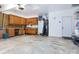 Spacious garage with work area, storage cabinets, and an exterior door at 8008 Alba Ct, Charlotte, NC 28269