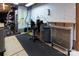 Basement workshop featuring pegboard, metal cabinets, and a rolling seat at 8008 Alba Ct, Charlotte, NC 28269