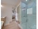 Elegant bathroom featuring a glass shower, marble walls and a soaking tub at 8039 Mcconnell Rd, Denver, NC 28037