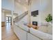 Bright living room with a fireplace, hardwood floors, and staircase at 8039 Mcconnell Rd, Denver, NC 28037