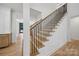 Staircase with wooden steps and black metal railings, leading upstairs at 8039 Mcconnell Rd, Denver, NC 28037