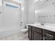 Well-lit bathroom featuring a shower-tub combo, toilet, and a dark wood vanity at 807 Herrons Ferry Rd, Rock Hill, SC 29730