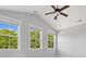 Bright bedroom with vaulted ceiling and three large windows offering views of lush greenery at 807 Herrons Ferry Rd, Rock Hill, SC 29730
