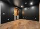 Dark accent wall makes this a cozy bonus room with unique lighting and herringbone floors at 807 Herrons Ferry Rd, Rock Hill, SC 29730