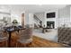 Open concept living and dining area with hardwood floors, fireplace, and stylish decor at 807 Herrons Ferry Rd, Rock Hill, SC 29730