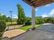 Outdoor living space includes brick and paver patios, green grass, and wooded views at 807 Herrons Ferry Rd, Rock Hill, SC 29730