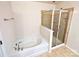 Bathroom featuring tub and glass shower at 8230 Viewpoint Ln, Cornelius, NC 28031