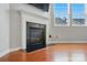 Living room featuring a fireplace and large windows to allow plenty of natural light at 8230 Viewpoint Ln, Cornelius, NC 28031