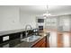 Open floor plan showcasing a kitchen with view of the living room and fireplace at 8230 Viewpoint Ln, Cornelius, NC 28031