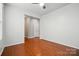 Spacious living room featuring hardwood floors, neutral walls and ceiling fan at 8230 Viewpoint Ln, Cornelius, NC 28031