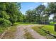 Large backyard with mature trees and plenty of space for outdoor activities and recreation at 85 Ruritan Park Rd, Stony Point, NC 28678