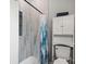 Bathroom featuring walk-in shower with attractive tile and a convenient storage cabinet at 85 Ruritan Park Rd, Stony Point, NC 28678
