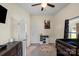 Carpeted bedroom featuring a lofted bed, area rug, and an open doorway at 85 Ruritan Park Rd, Stony Point, NC 28678