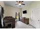 Cozy carpeted bedroom featuring a lofted bed, dresser, and window at 85 Ruritan Park Rd, Stony Point, NC 28678