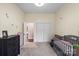Neutral Bedroom with a gray crib and a double-door closet at 85 Ruritan Park Rd, Stony Point, NC 28678