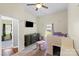 Carpeted bedroom featuring a lofted bed, dresser, and TV at 85 Ruritan Park Rd, Stony Point, NC 28678