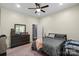 Bedroom featuring a queen bed, gray bedding, and a view of the room and closet at 85 Ruritan Park Rd, Stony Point, NC 28678